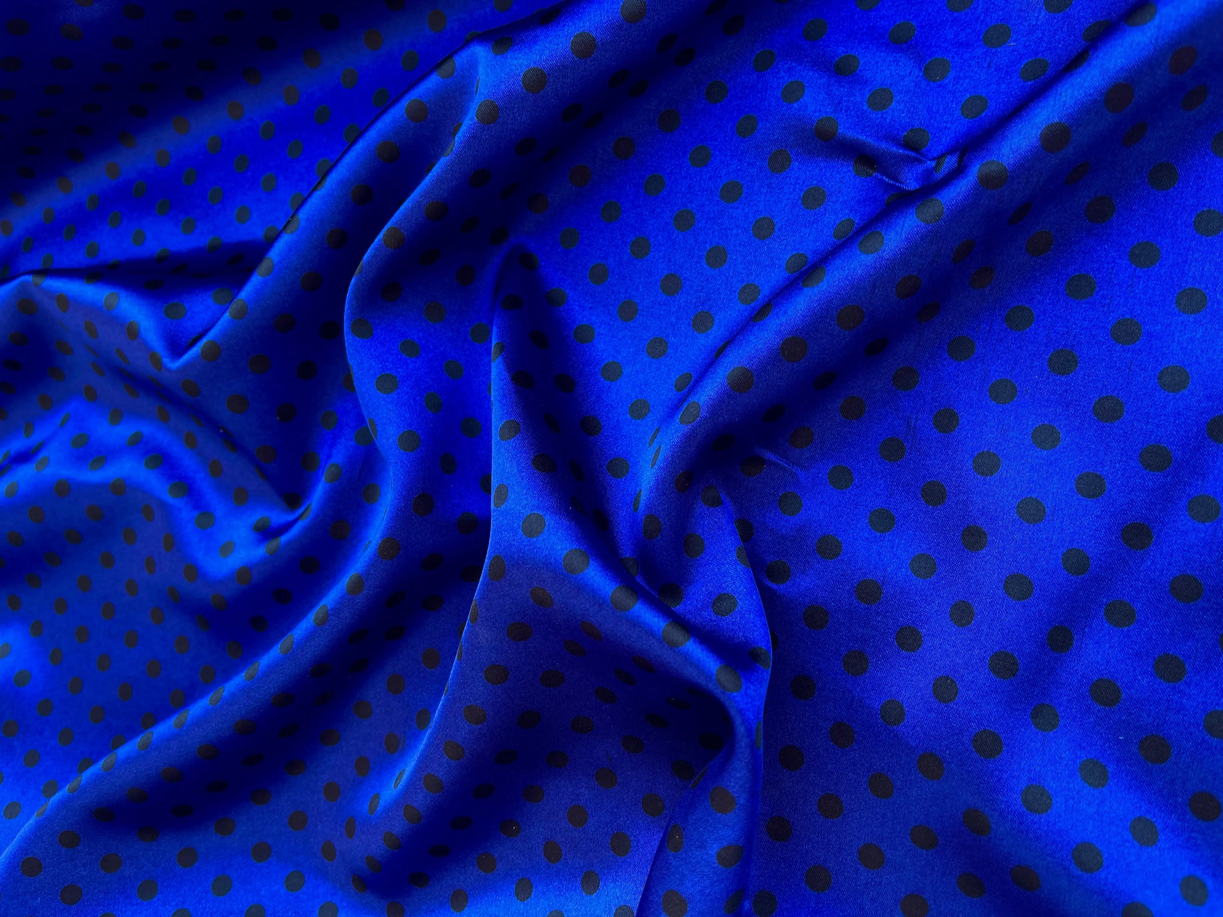 Faux silk charmeuse satin fabric by the yard - black polka dots on Royal Blue